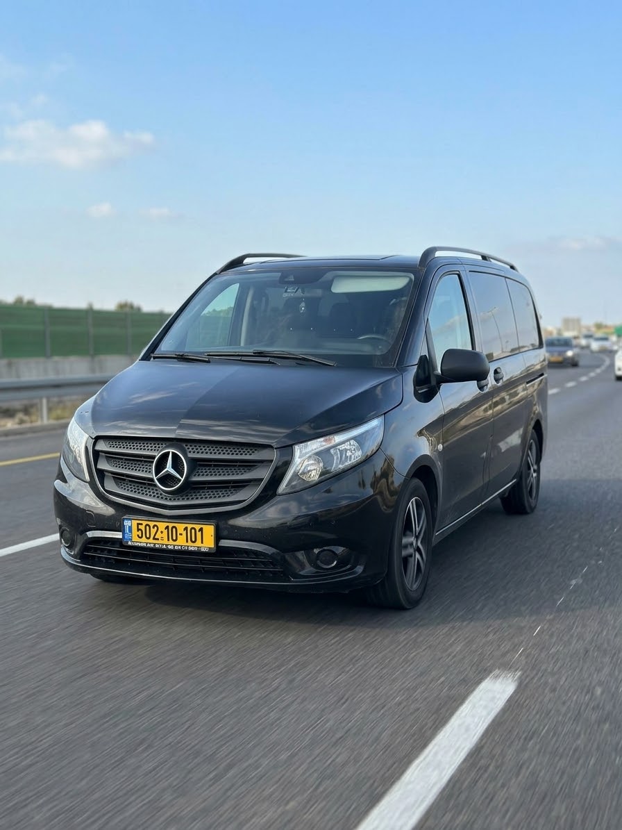Shlomi Rovshits's black Mercedes passenger van on the road in Israel